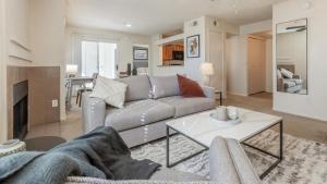 a living room with a couch and a table at Landing Modern Apartment with Amazing Amenities (ID8086X72) in Scottsdale