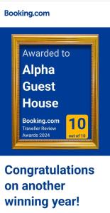 a picture of a sign for a guest house at Alpha Guest House in Rawalpindi