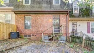 a brick house with two chairs in front of it at Landing Modern Apartment with Amazing Amenities (ID9248) in Nashville