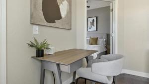 a room with a table and two chairs and a bed at Landing Modern Apartment with Amazing Amenities (ID3512X6) in El Paso
