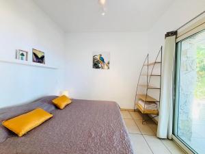 En eller flere senge i et værelse på Appartement Libeccio 41 LUMIO