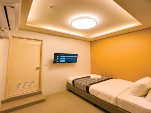 Postel nebo postele na pokoji v ubytování Casa Bocobo Hotel