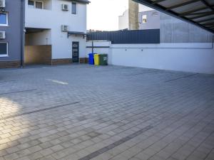 an empty parking lot in front of a building at APARTMANI INFINITY in Osijek