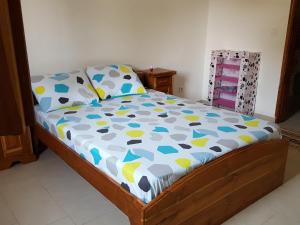 Ένα ή περισσότερα κρεβάτια σε δωμάτιο στο Maison Yaka