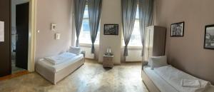 En eller flere senger på et rom på Apartmán Kaiser