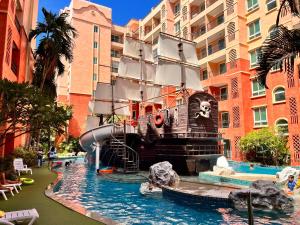 a water slide in the middle of a water park at Seven Seas Condo Resort in Jomtien Beach