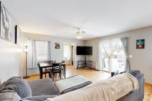 a living room with a couch and a table at Friendly Cove in Anchorage