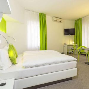 Postel nebo postele na pokoji v ubytování Hotel City Inn Basel + 33 fotografií