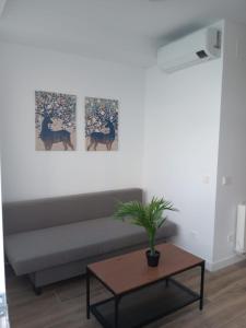 a living room with a couch and a table at Francos Rodriguez2 Apartments in Madrid