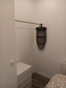 een slaapkamer met een bed en een lamp aan de muur bij Francos Rodriguez2 Apartments in Madrid