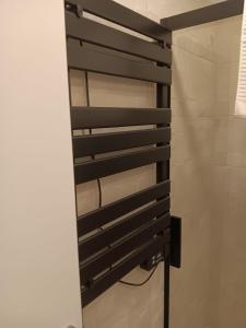 a bathroom with a black towel rack on the wall at Francos Rodriguez2 Apartments in Madrid