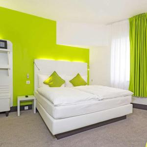 Postel nebo postele na pokoji v ubytování Hotel City Inn Basel