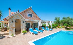 a villa with a swimming pool and patio furniture at Zante Sun I - Getaway Villa! in Zakynthos Town