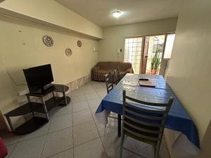 a living room with a table and a couch at BahiaCaracoles Apart in Antofagasta