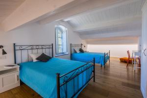 Llit o llits en una habitació de Villa Margherita