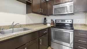 a kitchen with a sink and a microwave at Landing Modern Apartment with Amazing Amenities (ID1191X971) in Oakland