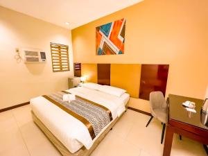 Postel nebo postele na pokoji v ubytování Casa Bocobo Hotel