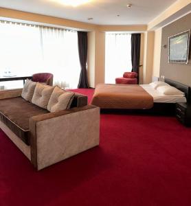 Postel nebo postele na pokoji v ubytování Mark Plaza Hotel