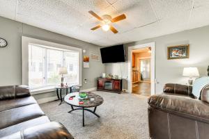 a living room with two couches and a flat screen tv at Pet-Friendly North Carolina Abode - Deck and Hot Tub in Concord