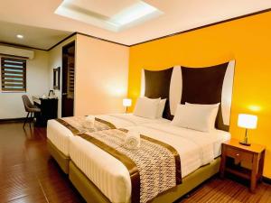 Postel nebo postele na pokoji v ubytování Casa Bocobo Hotel
