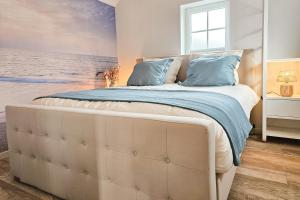 Postel nebo postele na pokoji v ubytování Vakantiewoning Gapinge GA02