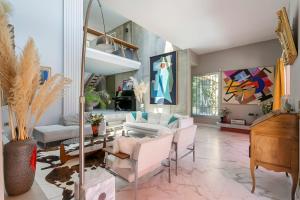 a living room with white furniture and a piano at Villa - La champenoise - Hamac Suites in Saint-Didier-au-Mont-dʼOr