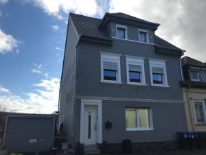 a gray house with white windows on top of it at 65qm Luxus Apartment mit Whirlpool Saarbrücken Uni Nähe in Saarbrücken