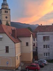 a lighthouse and cars parked in a parking lot at Górskie apartamenty Kowary in Kowary +37 photos