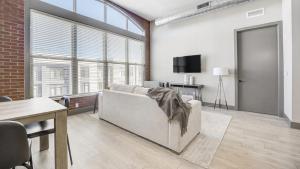 a living room with a couch and a tv at Landing Modern Apartment with Amazing Amenities (ID1000X551) in Westlake