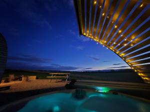 a view of a hot tub at night at Sedgewell Barn in Northallerton