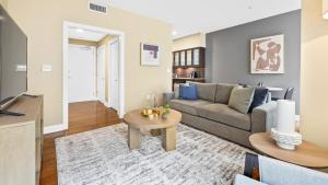 a living room with a couch and a table at Landing Modern Apartment with Amazing Amenities (ID7864X05) in Memphis