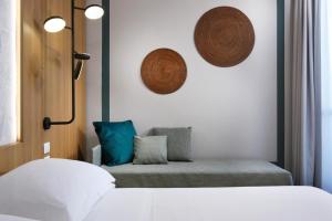 UNA Hotels Naxos Beach Sicilia客房内的一张或多张床位