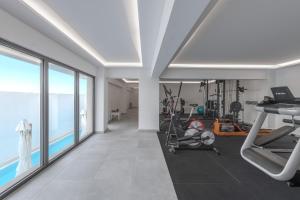a room with a gym with a view of the ocean at Lindos Royal Resort in Lindos