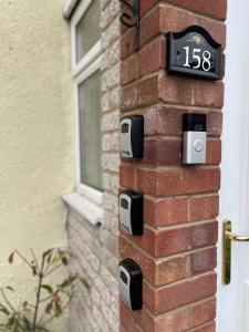 a brick wall with a clock on it at Barwell Manor - Master room 