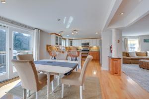 a dining room and kitchen with a table and chairs at Downtown Ogunquit Home 1 Mi to Beach! in Ogunquit