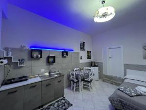 a kitchen and living room with a bed and a table at Da Rosaria in Naples +22 photos