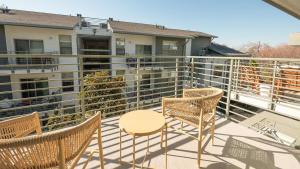 a patio with chairs and a table on a balcony at Landing Modern Apartment with Amazing Amenities (ID6842X82) in West Sacramento