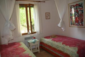 Llit o llits en una habitació de villa laurier rose