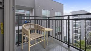 a chair sitting on top of a balcony at Landing - Modern Apartment with Amazing Amenities (ID1403X401) in Houston