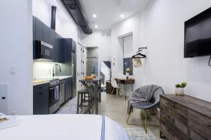 a kitchen with white walls and a dining room at 3-2 NEW Prime E Village Private outdoor! in New York