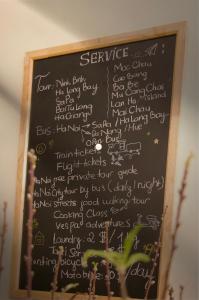 a chalkboard with the words service written on it at Hanoi Family Homestay in Hanoi