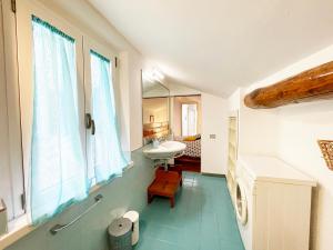 a bathroom with a sink and a sink at Casa della Chiocciola: In Centro in Siena +40 photos