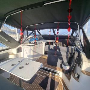 a view of the inside of a boat with a table at Barco KMP in Barcelona