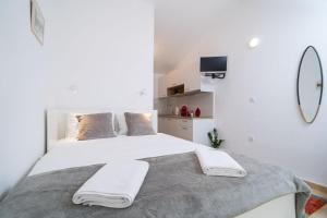 Postel nebo postele na pokoji v ubytování Apartment Jasna Gorica Dubrovnik + 17 fotografií