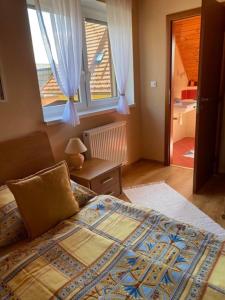Posteľ alebo postele v izbe v ubytovaní Apartmánový dom Anna