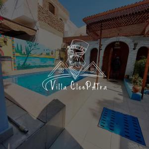 a villa with a swimming pool in a resort at Villa Cleopatra Luxor west bank in Luxor