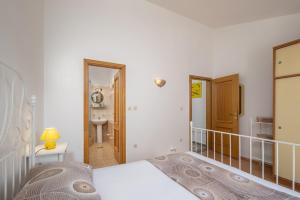 Postel nebo postele na pokoji v ubytování Apartments Lapida