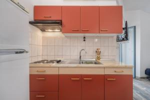 Kuchyň nebo kuchyňský kout v ubytování Apartments Lapida