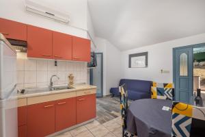 Kuchyň nebo kuchyňský kout v ubytování Apartments Lapida