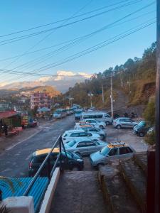 a group of cars parked in a parking lot at Aati cafe in Pokhara